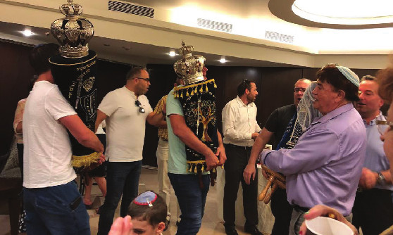 simchat torah celebrations with torah scrolls